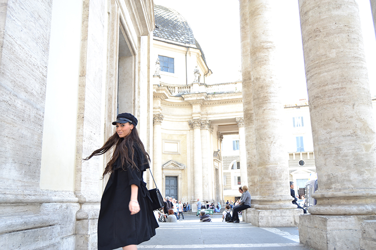 Military cap, fluid black trench, white sneakers, lace skirt, rome, italy