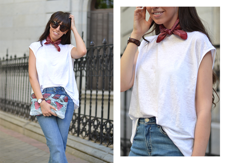 Street style outfit, flared jeans, white top, burgundy dot scarf, animal print clutch, cat eye sunglasses