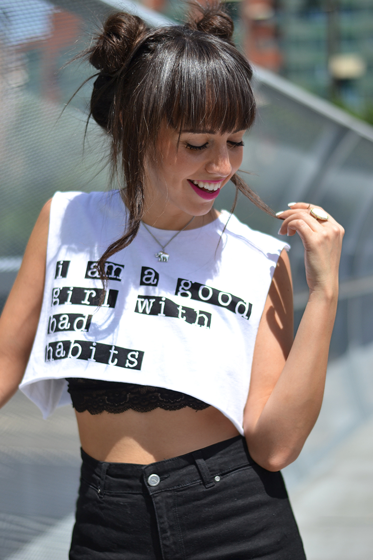 Street style, Double Top Knot Hair, cut out boots, crop top, lace bra, high waisted shorts, text tee, 