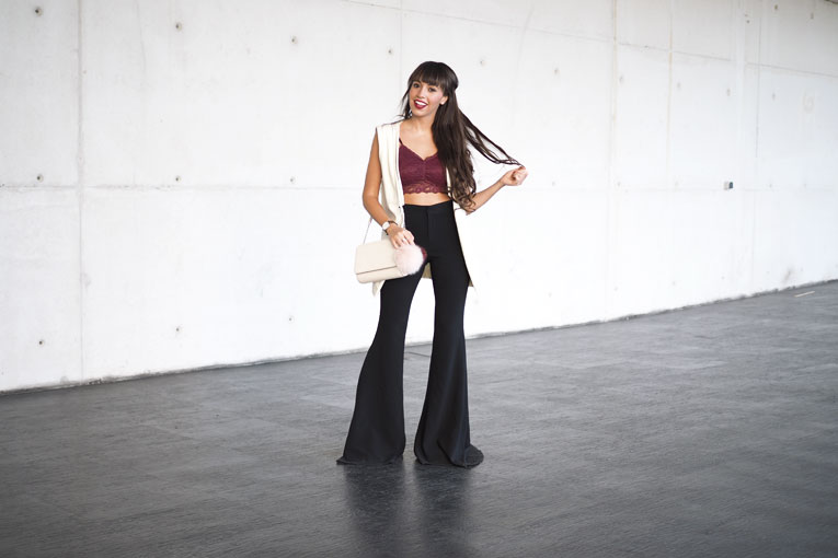 Street style, extra flared pants, lace top, long vest, pom pom bag, MBFW