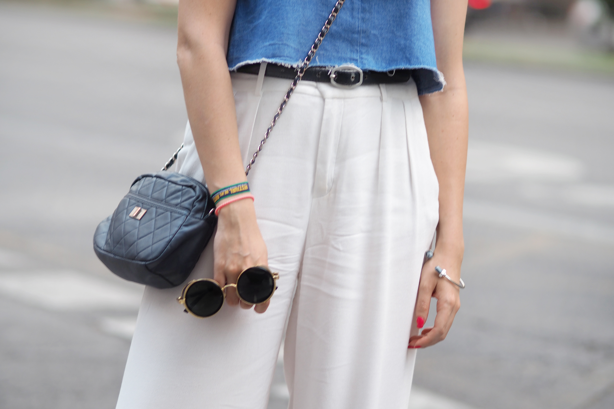 Street style, white palazzo pants, denim crop top, rounded sunglasses, 
