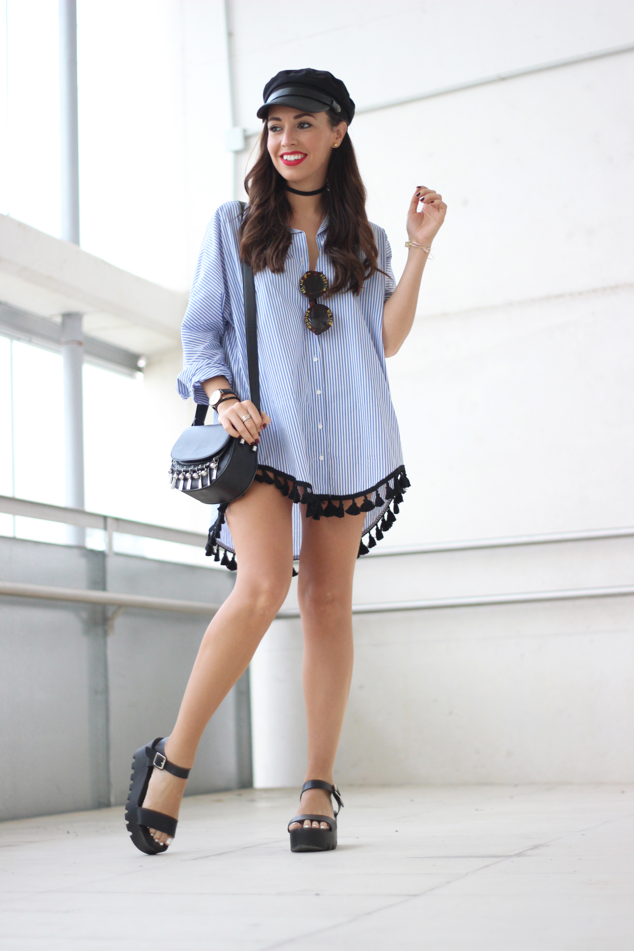 Street style, oversized trend, Striped shirt with pompoms, shirt dress, military black cap, chunky sandals