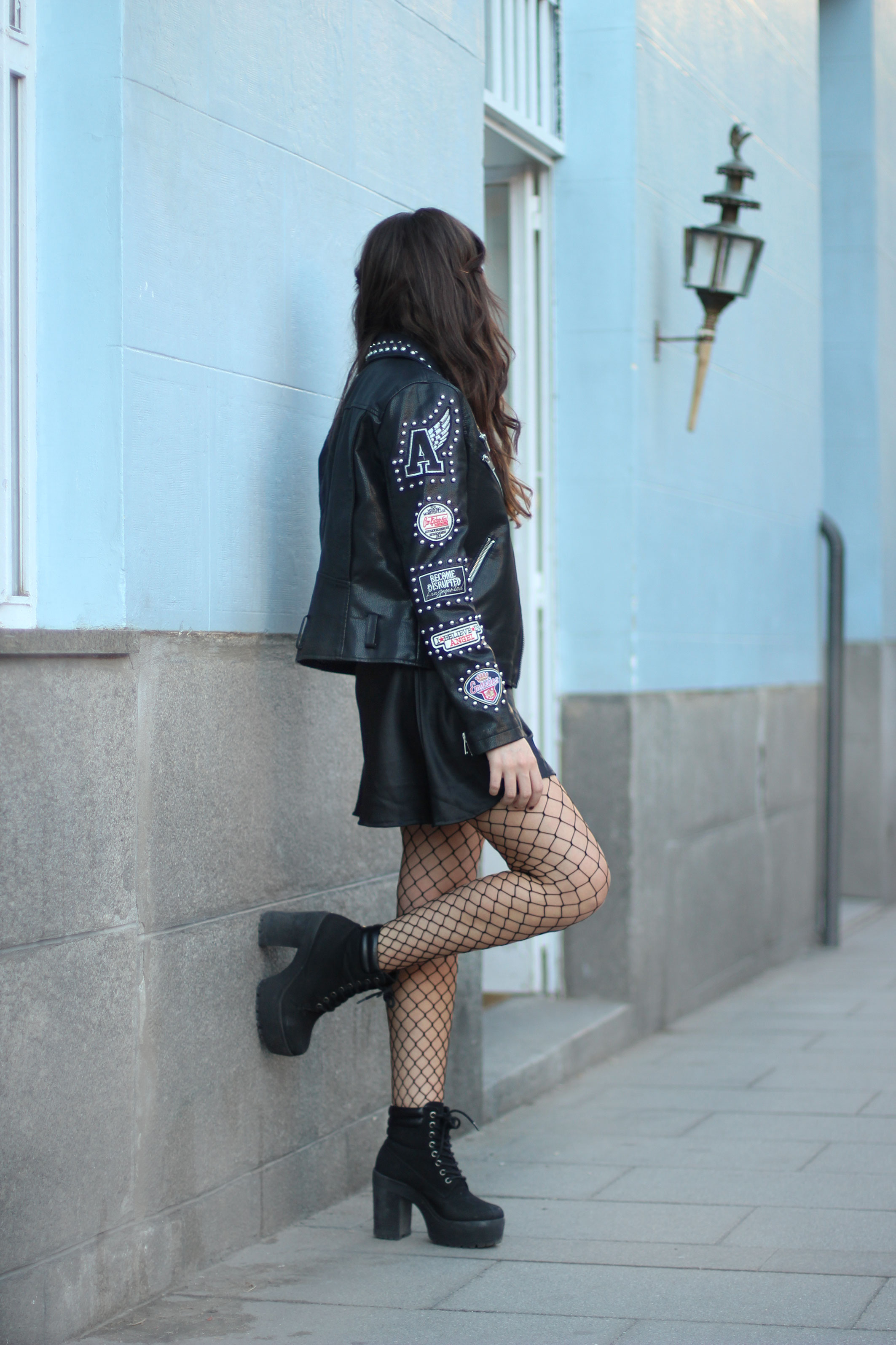 fishnet tights trend, lace dress, leather patch jacket, street style